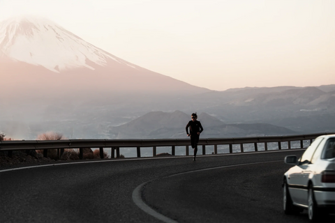 Nomio — runner on mountain road